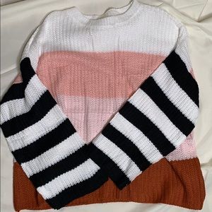 Multi colored, striped sweater.